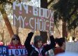‘What Is A Woman?’ Ads Pop Up At Women’s and Pro-Abortion Marches